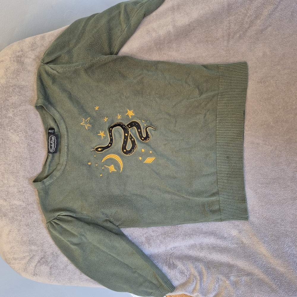 Green Sweater with Snake and Star Design